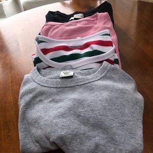 Four long sleeve teeshirts-  mix of exsmall and small- some are new , some not